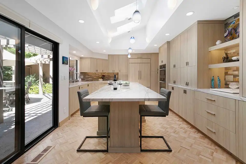 Kitchen remodeling by a Danville, CA design-build firm: contemporary Lafayette kitchen with light oak flat-panel cabinets and a long island