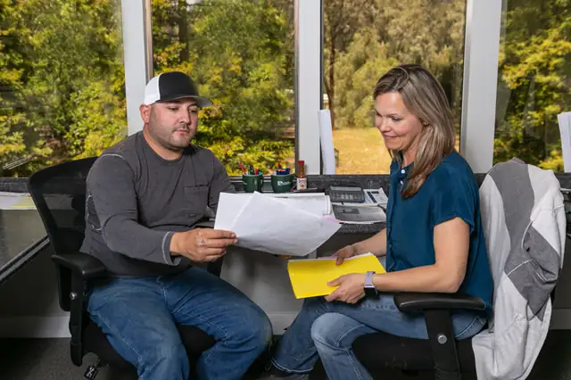 Gayler Design Build project manager and designer reviewing plans at the Danville office