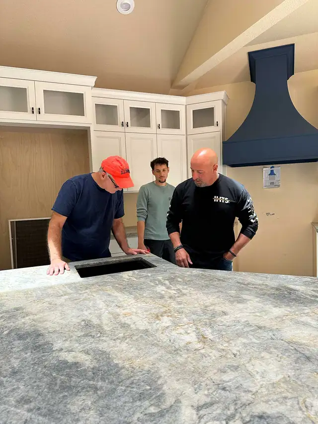 Gayler crew reviewing a stone countertop install during a San Ramon, CA kitchen addition